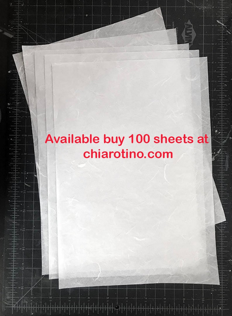 May include: A stack of 100 white sheets of paper with a subtle textured surface. The text "Available buy 100 sheets at chiarotino.com" is printed in red on the top sheet.