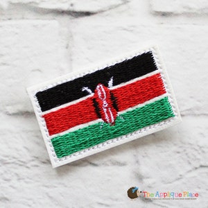 May include: Embroidered patch featuring the flag of Kenya. The rectangular patch has a white border and displays the flag's black, red, and green horizontal stripes, with a shield and spears in the center. The Applique Place logo is in the bottom right corner.