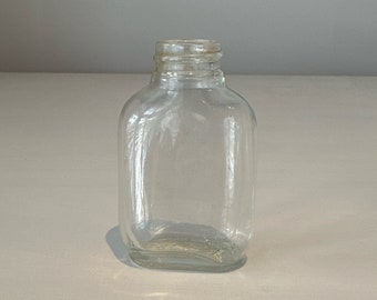 Mini early 1900s clear glass bottle UGB 3