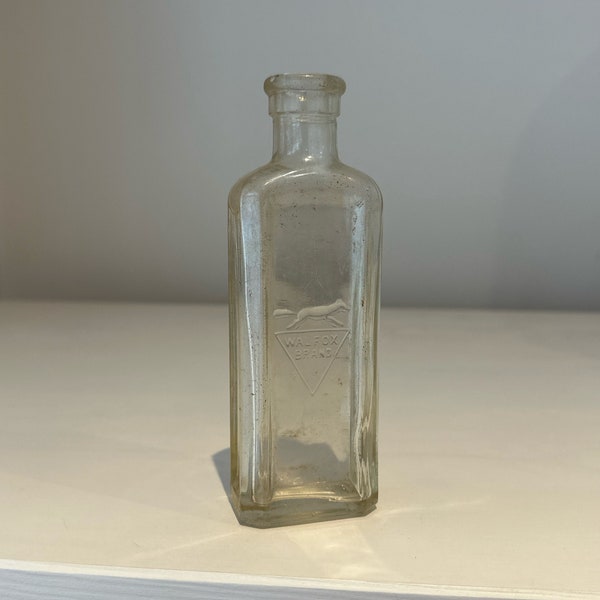 Walfox Brand clear antique glass bottle c1900s