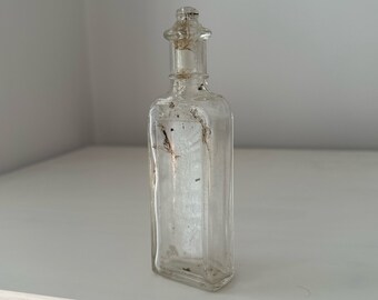 Vintage clear glass condiment or tincture bottle drip head