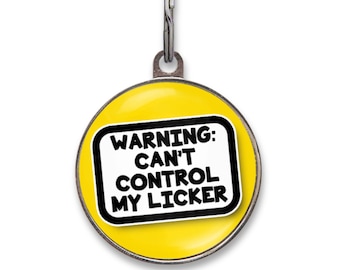 May include: A round yellow pet ID tag with a silver metal rim and a metal split ring at the top. The center features a white rectangular sign with a thick black border and the black text: WARNING: CAN'T CONTROL MY LICKER.
