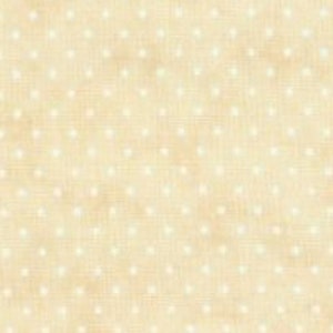 May include: A beige fabric with a white polka dot pattern. The fabric has a subtle texture.