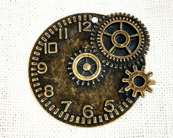May include: A bronze-colored clock face with Roman numerals and gears. The clock face has a decorative border and the gears are attached to the face.