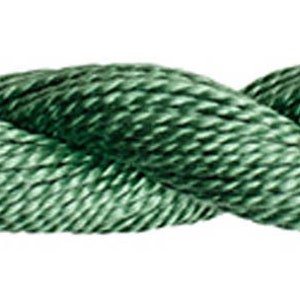 May include: A close-up of a twisted green cord. The cord is made of a soft, textured material.