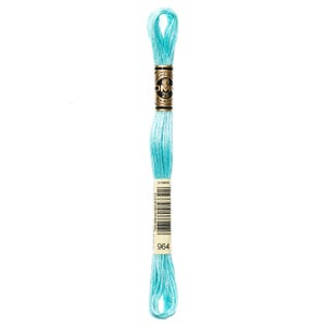 May include: A skein of light blue embroidery floss. The floss is wrapped around a cardboard label with the brand name and color number 964. The floss is a soft, pastel color, ideal for cross-stitch and embroidery projects.