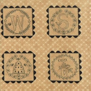May include: Four black and white squares with a brown background. Each square has a different design inside a wreath. The designs are the letter W, the letter S, a beehive, and a hand holding a heart.