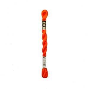 May include: A skein of orange embroidery floss with a DMC label. The label has the number 608 printed on it.