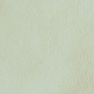 May include: A light green textured background with a subtle grainy pattern.