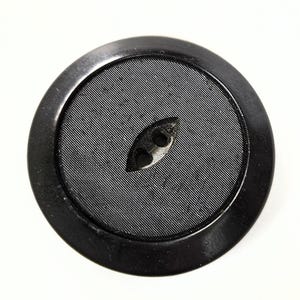 May include: A round black button featuring a smooth outer rim and a textured, ribbed center panel. The button has an elongated, eye-shaped recessed area in the middle containing two small holes for threading, designed for garment fastening.