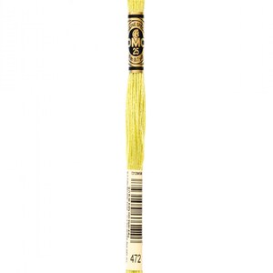 May include: A skein of DMC embroidery floss in color 472, a bright yellow-green shade. The floss is wound around a cardboard spool with a black and gold label that reads "DMC" and "25m (8.7 yd)".