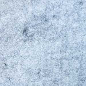 May include: A close-up of a light blue, fuzzy fabric with a slightly textured surface.