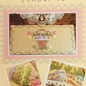 May include: A felt table runner with an Easter theme. The runner features a basket of eggs, tulips, and a heart. The text "Easter Blessings Table Runner #170" is printed on the bottom of the image.
