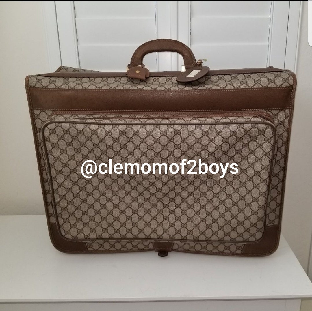 Vintage Gucci Plus brown monogram duffle bag with leather trimming and –  eNdApPi ***where you can find your favorite designer  vintages..authentic, affordable, and lovable.