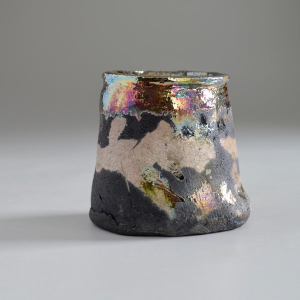 Raku fired vase black clay with a rainbow of luster glazes and crackle white, small