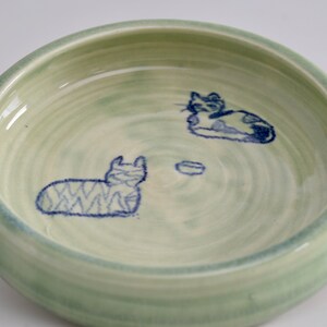 cat dish,"The Standoff", hand thrown porcelain, green glaze with drawing, small size