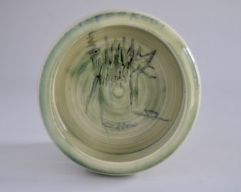 cat dish,"Spooked!!", hand thrown porcelain, green glaze with drawing,single serving size