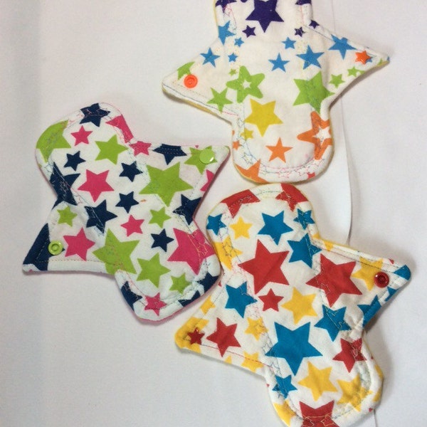 Set of 3 Stars all over  flannel  top light days pads.  Or incontinance liners ( Flannel  on fleece with 1 layer of zorb ) 2 have Star snaps