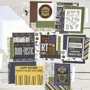 May include: A collection of birthday-themed papercrafting supplies. Includes cards with text like "Happy Birthday Dude" and "Man-tastic Celebration." The color palette features navy, olive green, brown, and white, with various patterns.