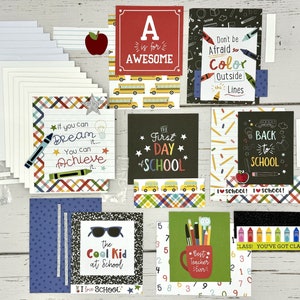May include: A collection of colorful cards with school-themed designs. The cards feature phrases like "A is for Awesome", "Don't be Afraid to Color Outside the Lines", "If you can Dream it... You can Achieve it", "The First Day of School", "Back to School", "The Cool Kid at School", and "Best Teacher Ever".