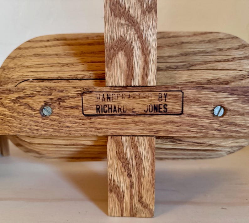 May include: A wooden bowl with a hand-crafted label that reads "HANDCRAFTED BY RICHARD E. JONES".