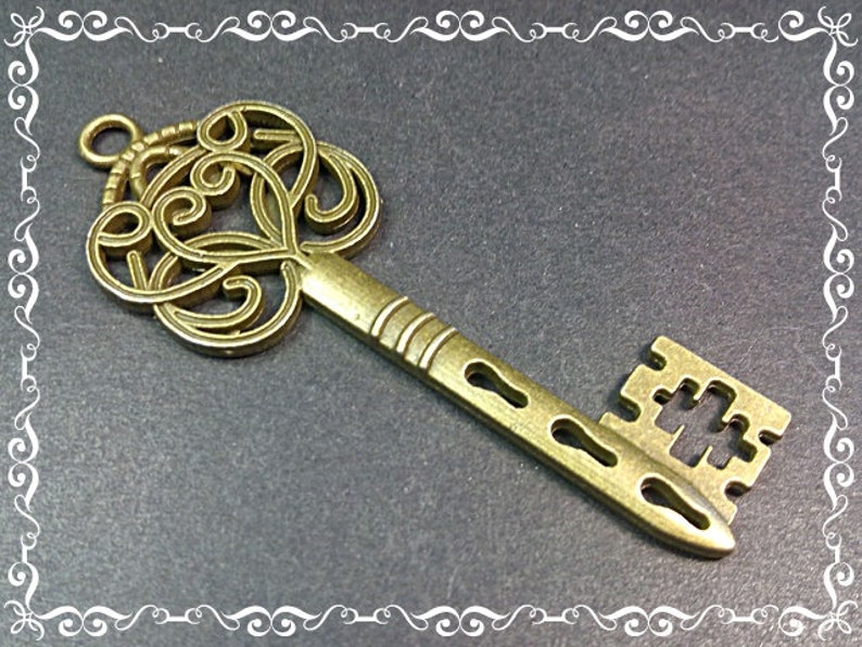 Filigree Key Pendant 60x21x2mm Bronze