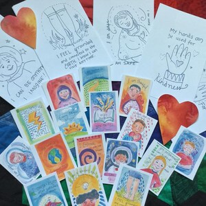 May include: A collection of colorful affirmation cards with illustrations and text. The cards feature positive messages such as "I feel grounded" and "I can be anything I imagine".