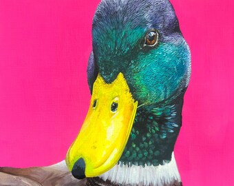 ¿Qué es el pato? - Cuadro de pato cuadrado sobre papel rosa