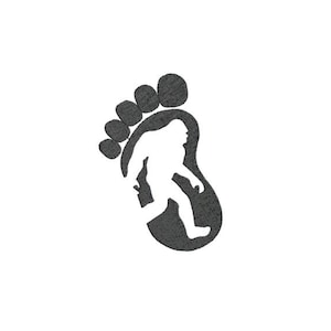 May include: A black silhouette of a Bigfoot footprint with a white silhouette of Bigfoot walking inside the footprint.