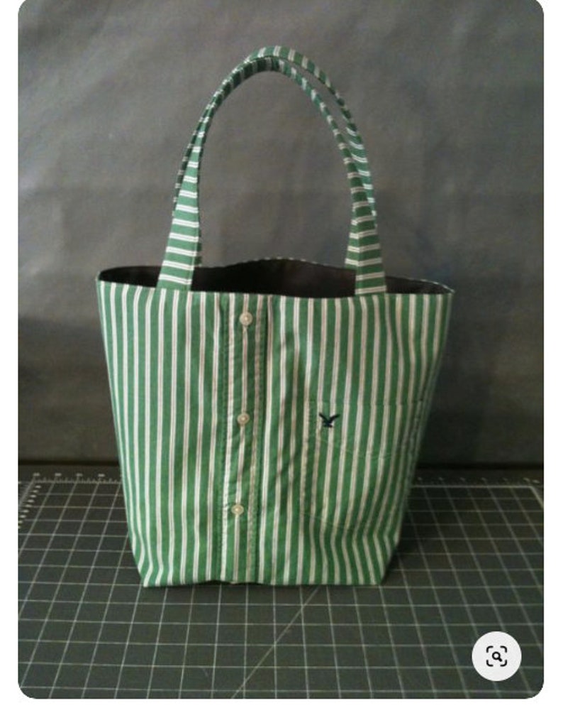 Small tote bag made from a men's button-down shirt. Bag depicted is from a green and white striped shirt