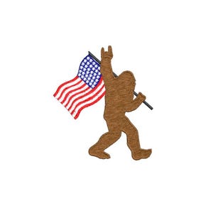 May include: A brown Bigfoot silhouette holding a red, white, and blue American flag with a stick. The Bigfoot is making a rock and roll hand gesture.