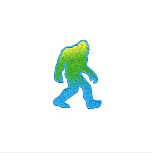 May include: A colourful illustration of a Bigfoot creature walking. The figure is shaded with a gradient of green and blue, outlined in blue, and set against a white background. The design is simple and eye-catching.