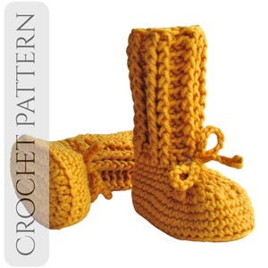 May include: Mustard yellow crochet baby boots with a ribbed texture and a small bow detail. The boots are handmade and appear soft and warm. The text "CROCHET PATTERN" is visible on the left side.