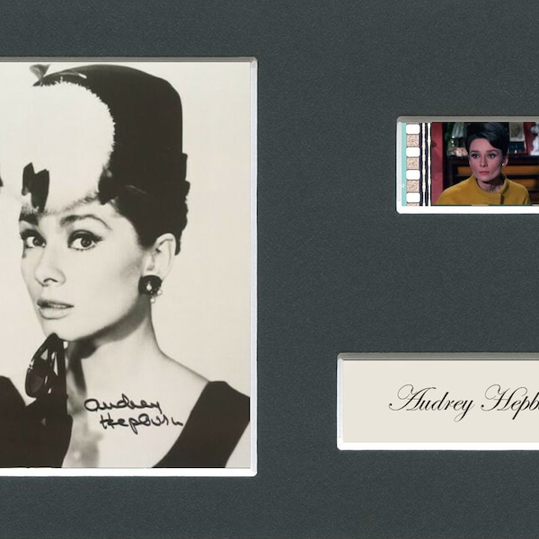Very Rare Audrey Hepburn original rare & genuine film cell from a movie starring them mounted ready for framing with pre-printed autograph!
