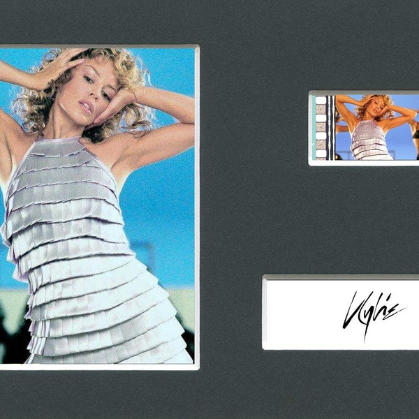 A Kylie Minogue La La La silver dress original rare & genuine film cell from the music video mounted ready for framing!