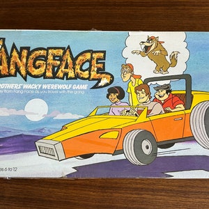 May include: A vintage board game box featuring a cartoon illustration of a yellow car with four passengers. The game is called "Fangface: Parker Brothers' Wacky Werewolf Game". The box is blue and white with a purple and blue background.