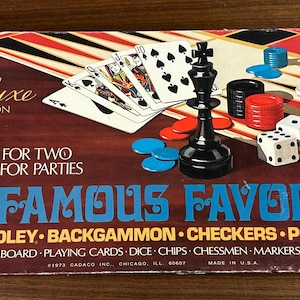 May include: Vintage "Five Famous Favorites" board game set. The box features the text "Deluxe Edition" and lists games like Chess, Backgammon, and Poker. Includes game board, playing cards, dice, chips, chessmen, and markers.