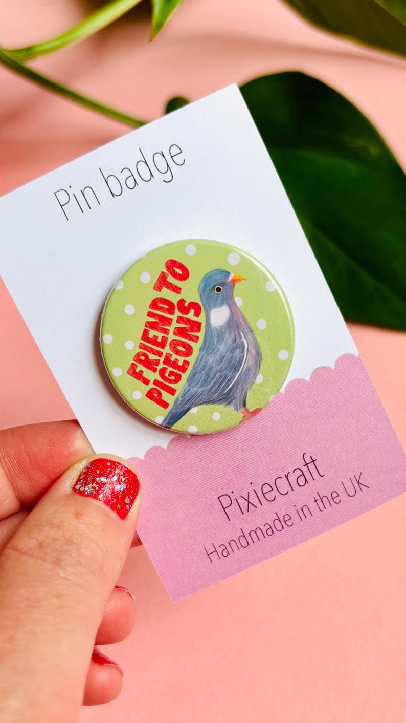 cute pigeon hand drawn badge on a green and white polka dot background that reads friend to pigeons. gift for pigeon lovers
