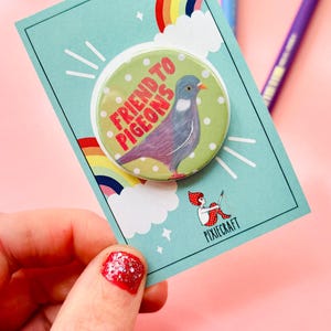 cute pigeon quirky handmade badge m on a green and white polka dot background that reads friend to pigeons. The cute pin is presented on a colourful gift card