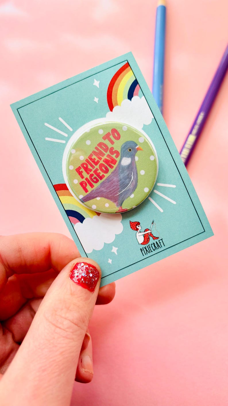 cute pigeon quirky handmade badge m on a green and white polka dot background that reads friend to pigeons. The cute pin is presented on a colourful gift card