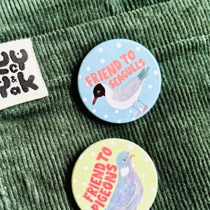 cute pigeon hand drawn badge on a green and white polka dot background that reads friend to pigeons. perfect gift for pigeon lovers