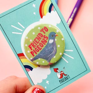 cute pigeon hand drawn badge on a green and white polka dot background that reads friend to pigeons