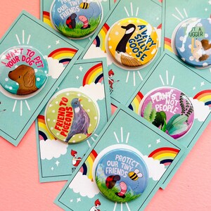 group of colourful handmade pin bags and magnets with animal designs