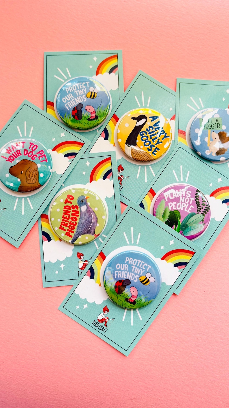 group of colourful handmade pin bags and magnets with animal designs