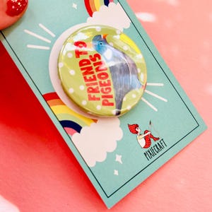 cute pigeon quirky handmade badge m on a green and white polka dot background that reads friend to pigeons. The cute pin is presented on a colourful gift card