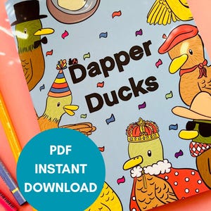 May include: A light blue book cover with the title "Dapper Ducks" and illustrations of ducks wearing hats and accessories. A teal circle with the text "PDF INSTANT DOWNLOAD" is in the lower left corner. Colored pencils are visible.