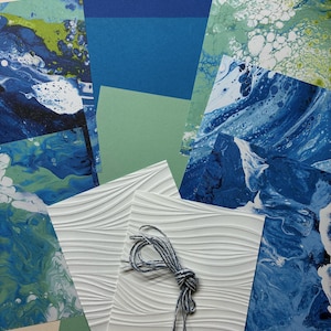 May include: A collection of patterned paper and cardstock in shades of blue, green, and white. Some sheets feature a wave-like embossed texture. A bundle of gray and white twine is included. The text "Kikumi Designs Images Stampin' UP!" is visible.