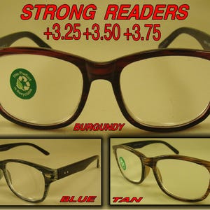 May include: Three pairs of reading glasses in different colors: burgundy, blue, and tan. The glasses have a rectangular shape with a clear lens. The text "STRONG READERS +3.25 +3.50 +3.75" is displayed above the glasses. The text "BURGUNDY", "BLUE", and "TAN" are displayed below each pair of glasses.