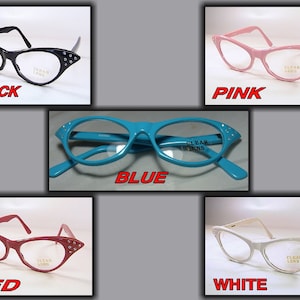 May include: A collection of cat-eye style eyeglasses in various colors: black, pink, blue, red, and white. Each pair features clear lenses and decorative embellishments on the outer corners. The text "CLEAR LENS" is visible on the lenses.