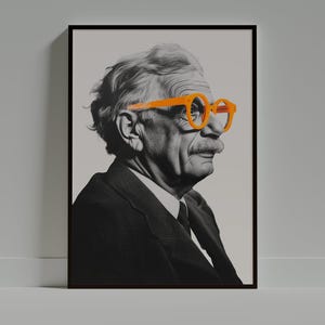 May include: A black and white portrait of a man wearing a suit and orange-rimmed glasses. The man has a moustache and is looking to the right.